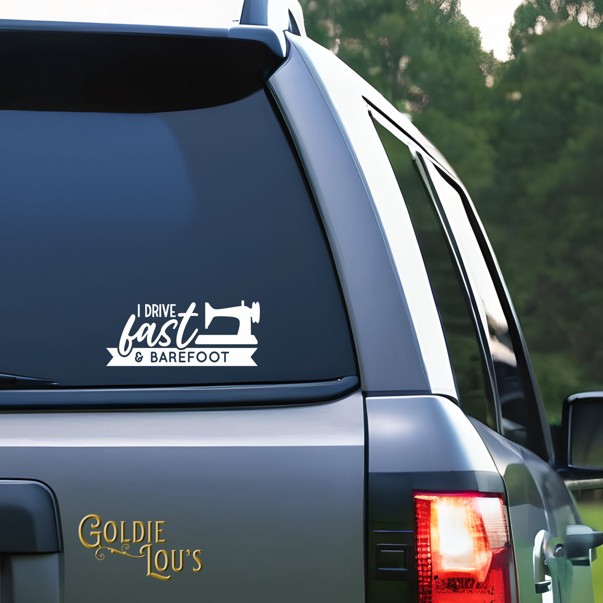I Drive Fast and Barefoot Car Vinyl Decal on the rear window of a silver car