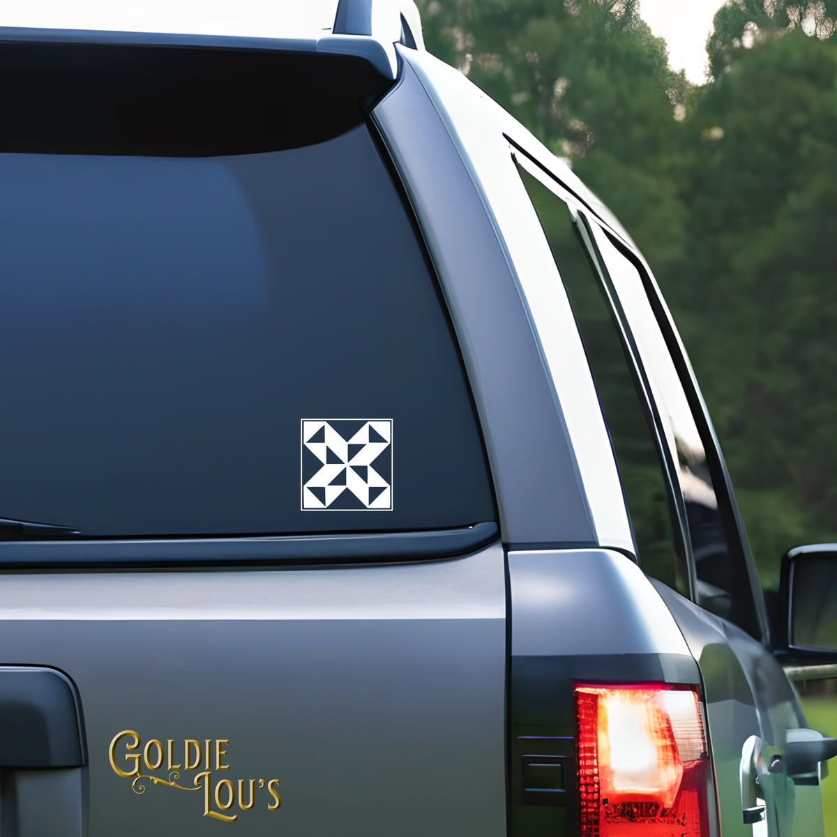 Quilt Block #1 Car Vinyl Decal on the rear window of a silver car