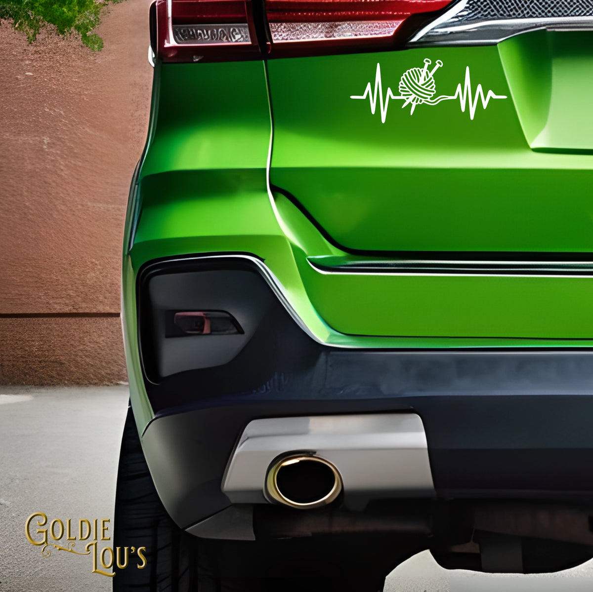 Yarn Heartbeat Car Vinyl Decal on the rear window of a green car
